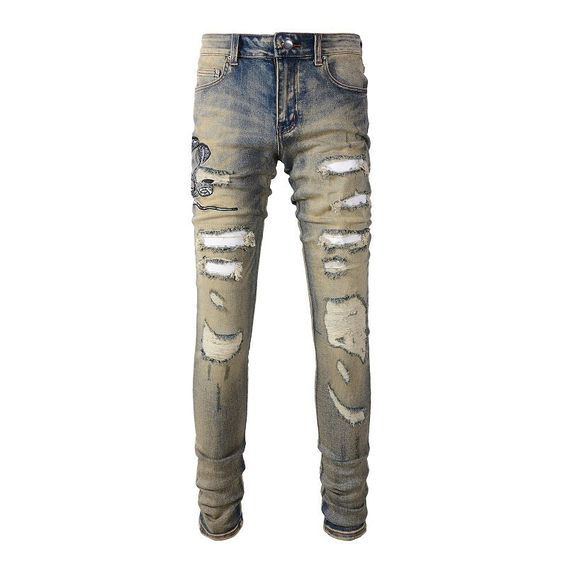 Three Headed Snake Embroidery With Torn Holes, Patchwork Leather, Distressed Stretch Slim Fitting Light Colored Jeans