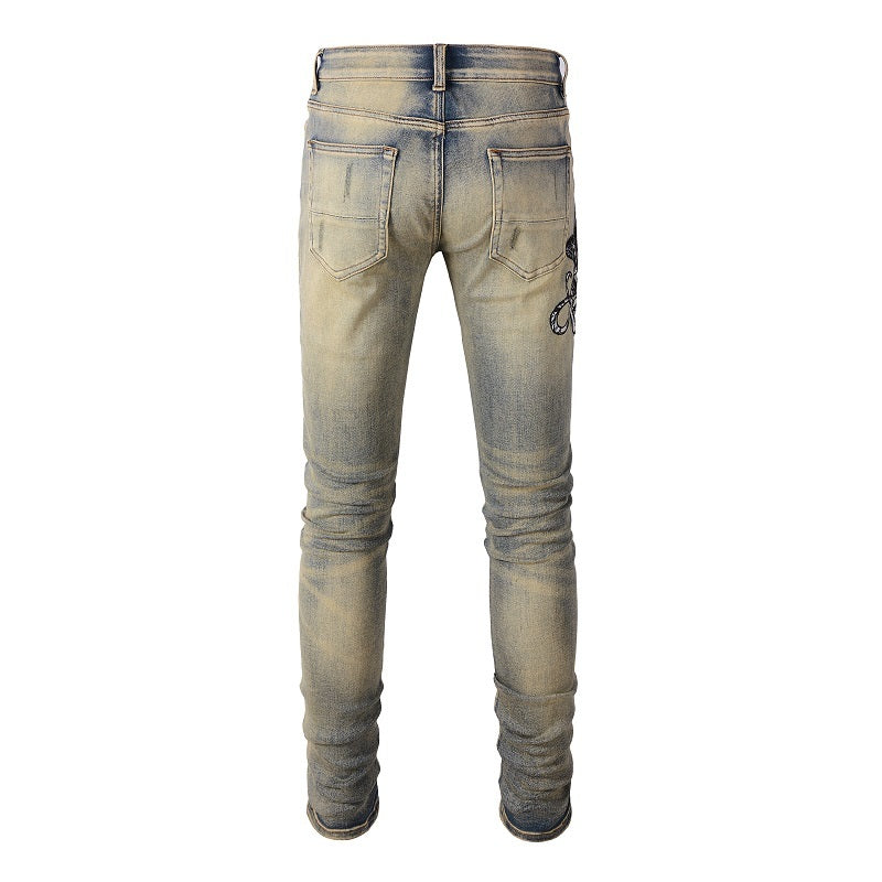 Three Headed Snake Embroidery With Torn Holes, Patchwork Leather, Distressed Stretch Slim Fitting Light Colored Jeans